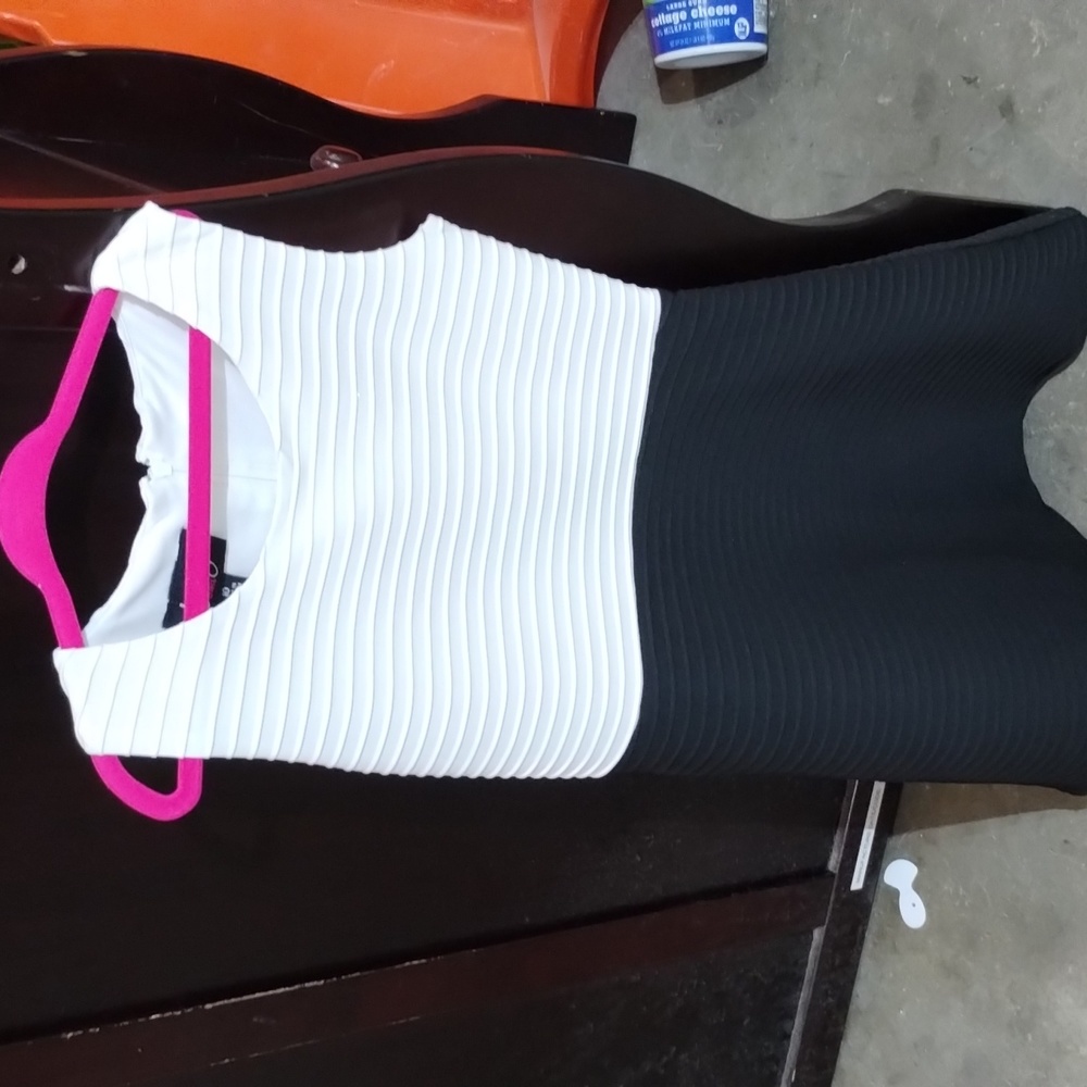 White and black dress the brand by and by girls it's like a ruffled dress